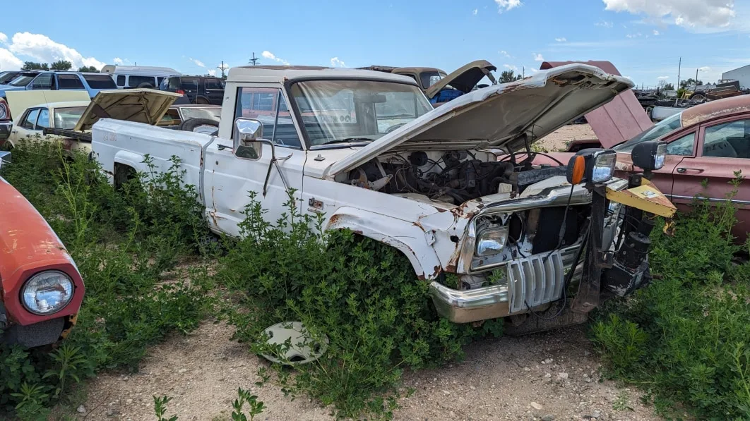 "Vintage AMC Jeep SJ Pickup with Snowplow Mount Found in Wyoming Car Graveyard"