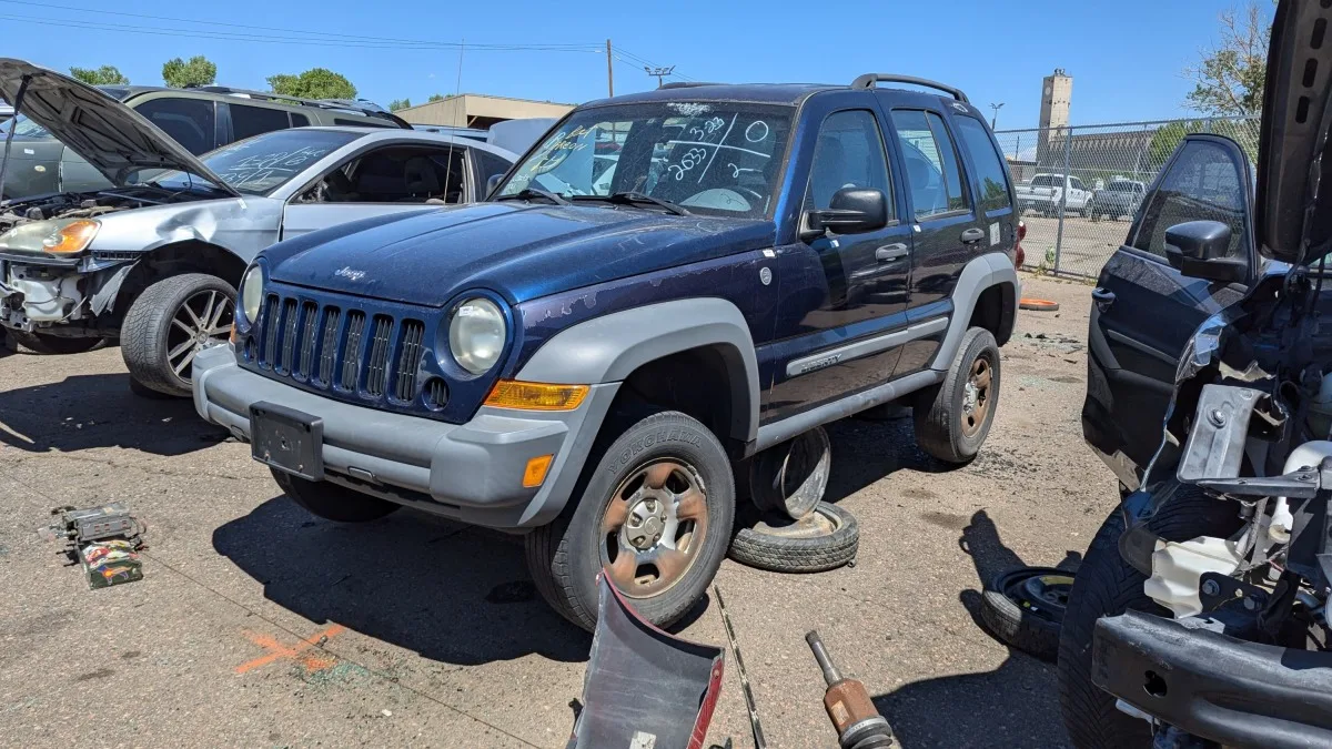 "Rare Find: First-Generation Jeep Liberty Found in Junkyard with Manual Transmission"